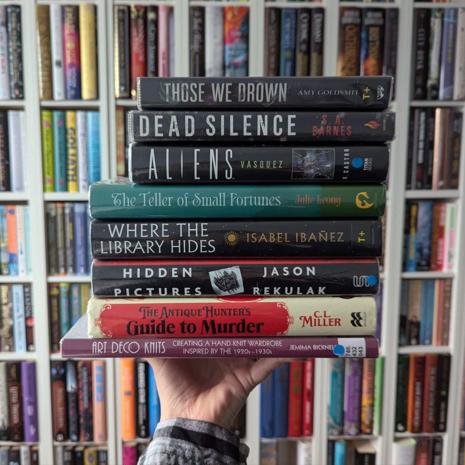 A stack of eight library books